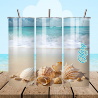 All sides of tumbler showing seashells on beach with ocean waves